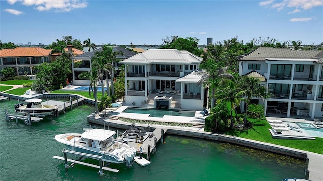 1435 Westway Dr, Sarasota, FL 34236 - dock area with boat lift, a balcony, a patio, and a water view