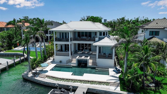 1435 Westway Dr, Sarasota, FL 34236 - rear view of house with a balcony, a water view, an outdoor pool, and a patio area