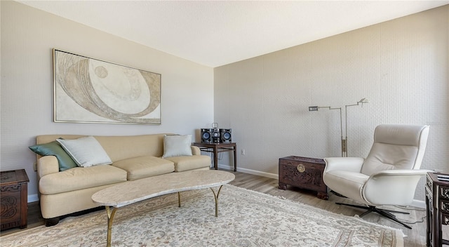 6157 Midnight Pass Rd Unit B42, Sarasota, FL 34242 - living area featuring light wood-style flooring and baseboards