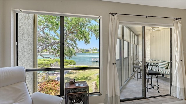 6157 Midnight Pass Rd Unit B42, Sarasota, FL 34242 - entryway featuring light wood-type flooring, a water view, and ceiling fan