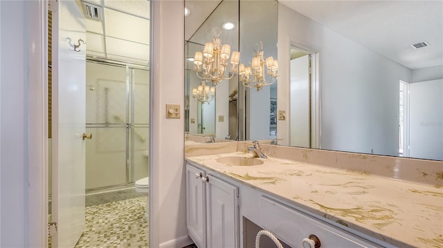 6157 Midnight Pass Rd Unit B42, Sarasota, FL 34242 - bathroom with a shower stall, an inviting chandelier, visible vents, toilet, and vanity