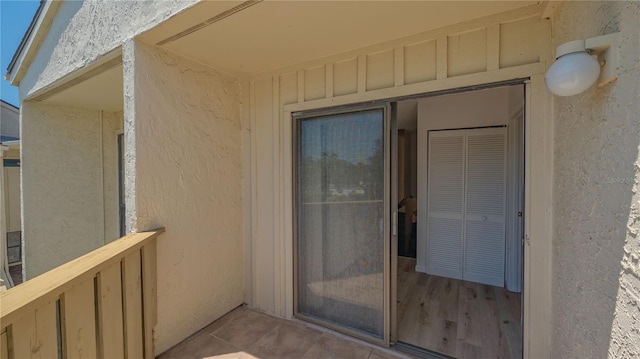 6157 Midnight Pass Rd Unit B42, Sarasota, FL 34242 - view of exterior entry with board and batten siding and stucco siding