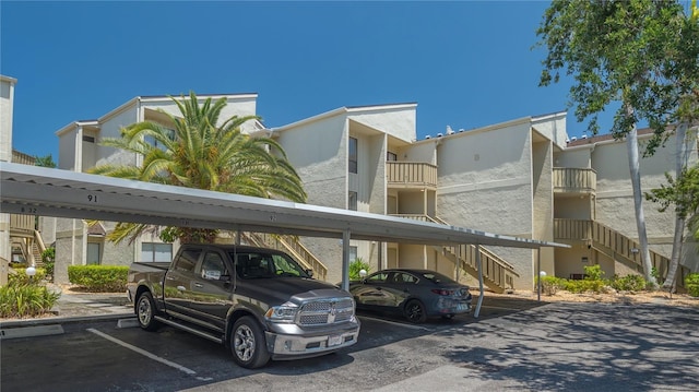 6157 Midnight Pass Rd Unit B42, Sarasota, FL 34242 - covered parking lot with stairway