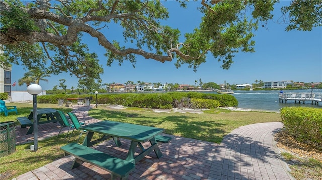 6157 Midnight Pass Rd Unit B42, Sarasota, FL 34242 - view of home's community with a lawn, a patio area, and a water view