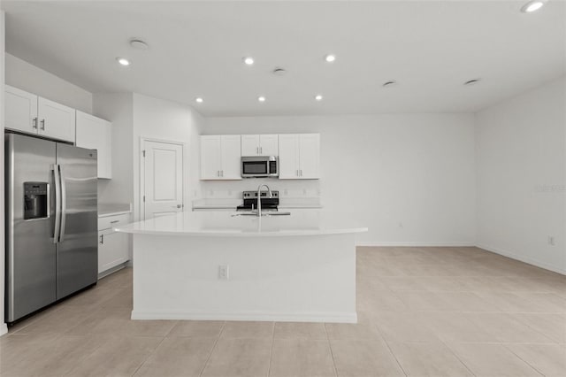 8596 Lunar Skye St, Sarasota, FL 34241 - kitchen featuring light countertops, a sink, appliances with stainless steel finishes, and a center island with sink