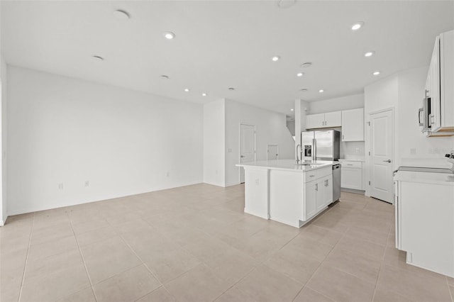 8596 Lunar Skye St, Sarasota, FL 34241 - kitchen featuring recessed lighting, light countertops, a center island with sink, appliances with stainless steel finishes, and open floor plan