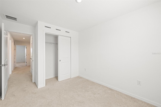 8596 Lunar Skye St, Sarasota, FL 34241 - unfurnished bedroom with recessed lighting, a closet, visible vents, and light colored carpet