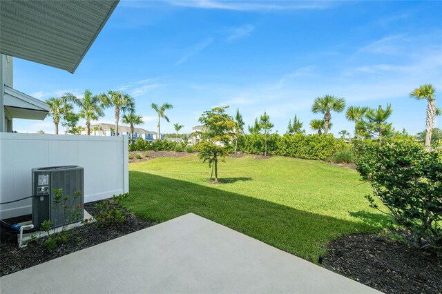 8596 Lunar Skye St, Sarasota, FL 34241 - view of yard featuring central air condition unit and a patio