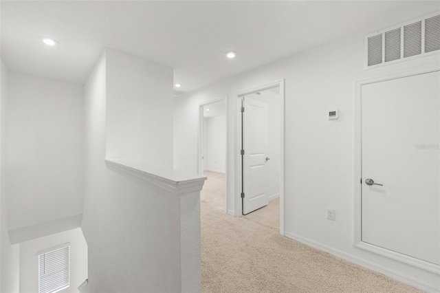 8596 Lunar Skye St, Sarasota, FL 34241 - corridor with light carpet, visible vents, and recessed lighting