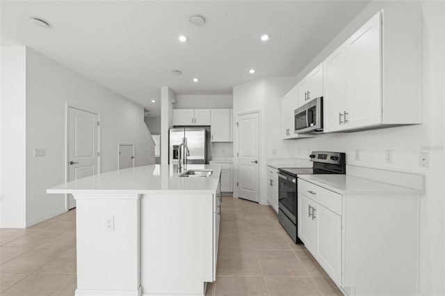 8596 Lunar Skye St, Sarasota, FL 34241 - kitchen with stainless steel appliances, a sink, recessed lighting, and light tile patterned floors