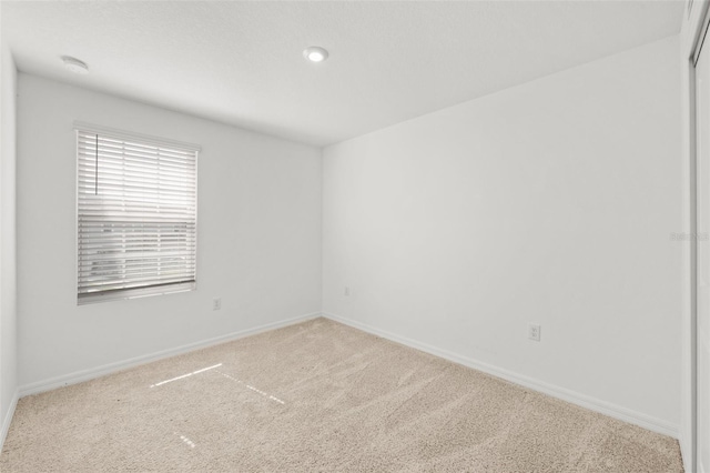 8596 Lunar Skye St, Sarasota, FL 34241 - carpeted empty room with baseboards