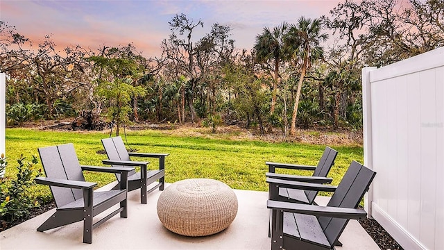 8596 Lunar Skye St, Sarasota, FL 34241 - patio terrace at dusk featuring a yard