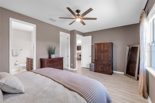 10806 52nd Ct E, Parrish, FL 34219 - bedroom with light wood-style flooring, a ceiling fan, and ensuite bath