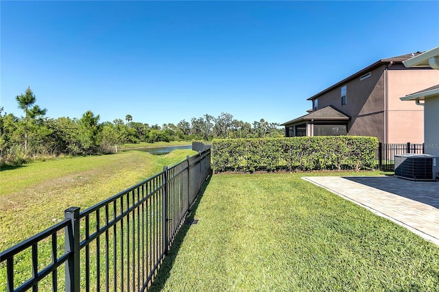 10806 52nd Ct E, Parrish, FL 34219 - fenced backyard featuring a patio and a water view