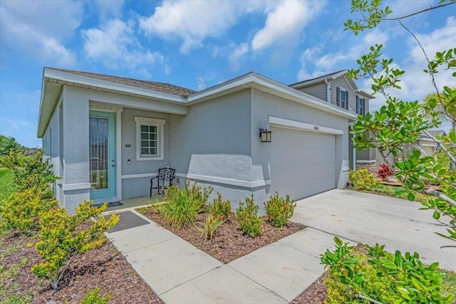 10616 High Noon Trl, Parrish, FL 34219 - ranch-style home featuring concrete driveway, an attached garage, and stucco siding