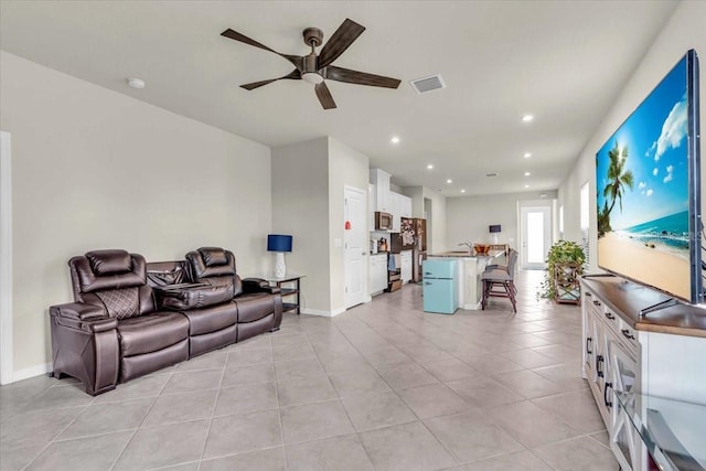 10616 High Noon Trl, Parrish, FL 34219 - living area with a ceiling fan, visible vents, baseboards, recessed lighting, and light tile patterned flooring