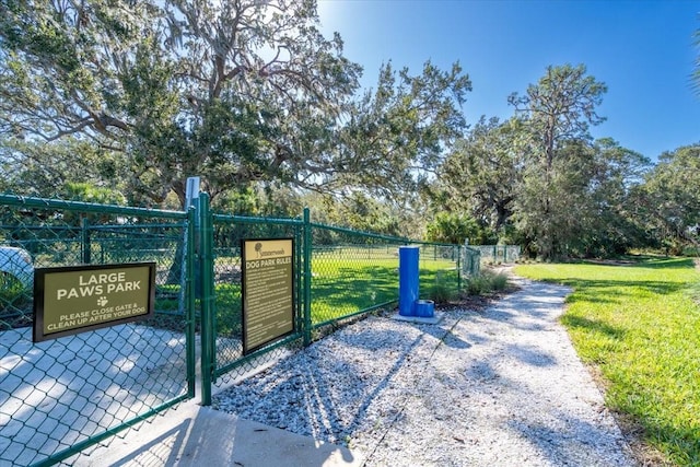 10616 High Noon Trl, Parrish, FL 34219 - view of gate with a lawn and fence