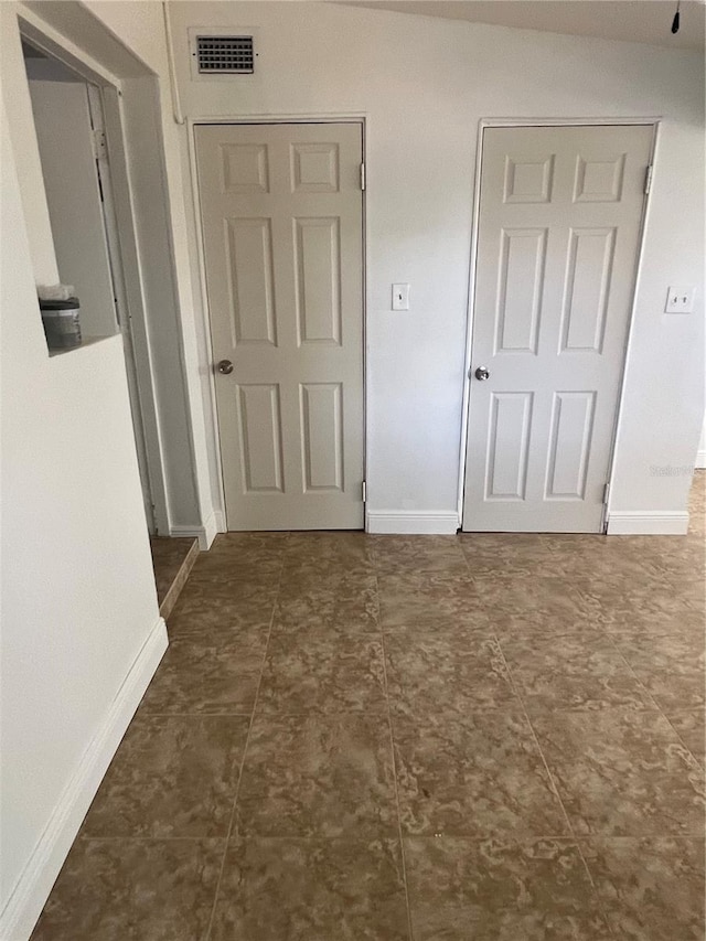 interior space with visible vents and baseboards