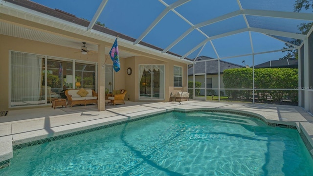 5355 Anthony Ln, Sarasota, FL 34233 - outdoor pool featuring a patio area, outdoor lounge area, ceiling fan, and glass enclosure