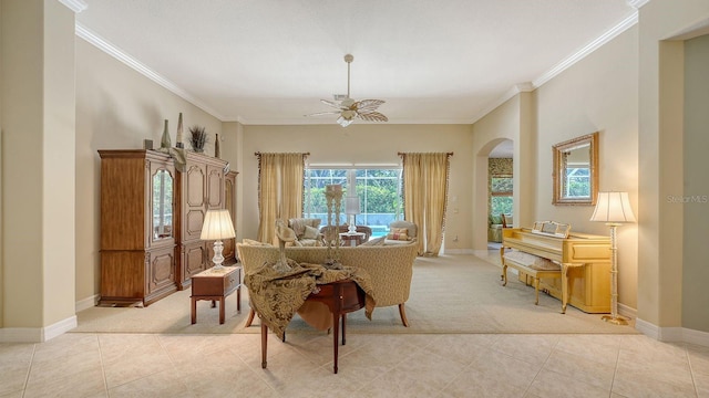 5355 Anthony Ln, Sarasota, FL 34233 - dining room with light colored carpet, arched walkways, ornamental molding, baseboards, and light tile patterned floors