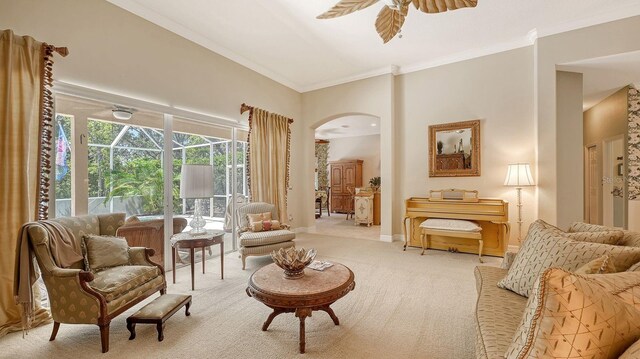 5355 Anthony Ln, Sarasota, FL 34233 - living area featuring arched walkways, ceiling fan, carpet floors, ornamental molding, and baseboards