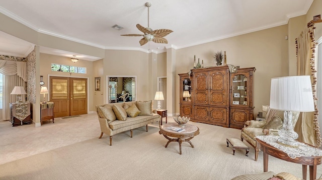5355 Anthony Ln, Sarasota, FL 34233 - living room featuring light carpet, crown molding, ceiling fan, and baseboards