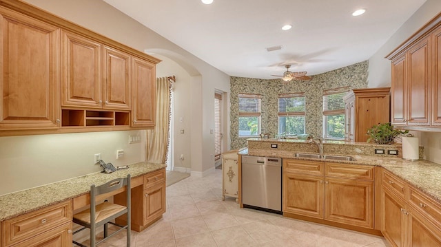 5355 Anthony Ln, Sarasota, FL 34233 - kitchen with stainless steel dishwasher, a sink, a ceiling fan, light stone counters, and recessed lighting