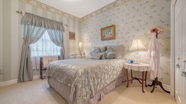 5355 Anthony Ln, Sarasota, FL 34233 - bedroom featuring light carpet, baseboards, and wallpapered walls