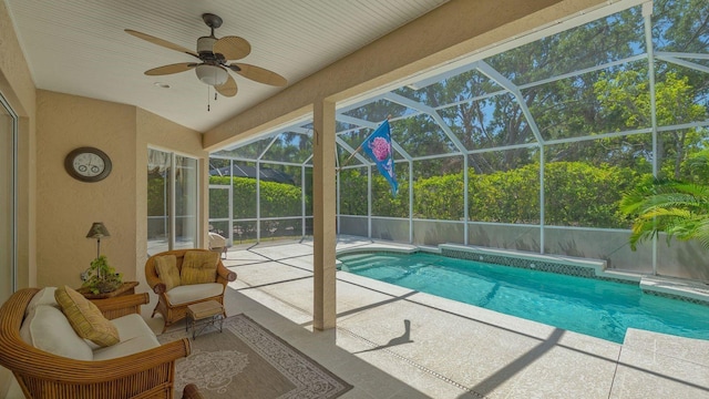 5355 Anthony Ln, Sarasota, FL 34233 - outdoor pool featuring a patio area, ceiling fan, and glass enclosure