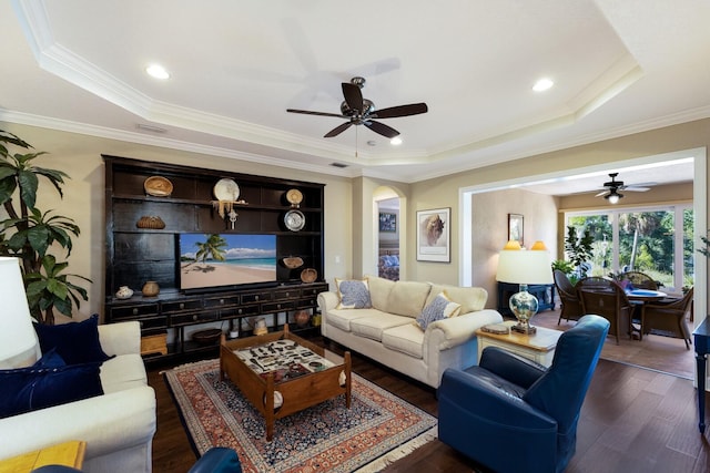 2397 Vaccaro Dr, Sarasota, FL 34231 - living area featuring ceiling fan, a raised ceiling, dark wood-style floors, and crown molding