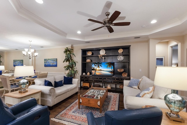 2397 Vaccaro Dr, Sarasota, FL 34231 - living area featuring arched walkways, ceiling fan, crown molding, wood finished floors, and a chandelier