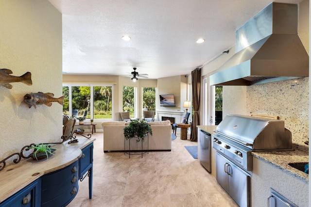 2397 Vaccaro Dr, Sarasota, FL 34231 - view of patio with area for grilling, ceiling fan, and an outdoor living space with a fireplace