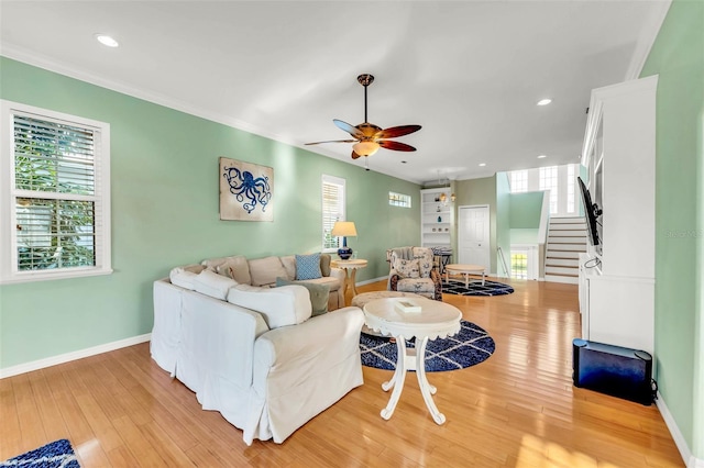 426 Magnolia Ave, Anna Maria, FL 34216 - living area featuring stairway, ceiling fan, and a wealth of natural light