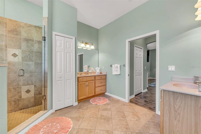 426 Magnolia Ave, Anna Maria, FL 34216 - full bath featuring a shower stall, baseboards, vanity, and tile patterned flooring