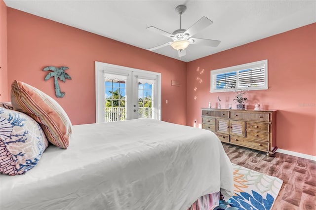 426 Magnolia Ave, Anna Maria, FL 34216 - bedroom featuring french doors, wood finished floors, access to outside, and multiple windows