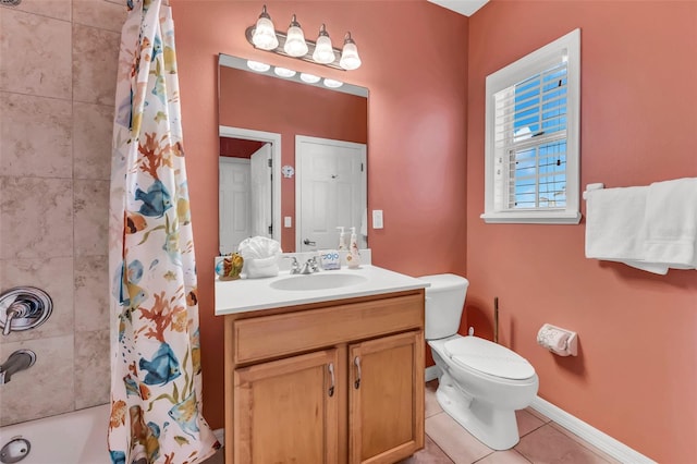 426 Magnolia Ave, Anna Maria, FL 34216 - full bathroom with tile patterned flooring, shower / bathtub combination with curtain, toilet, vanity, and baseboards