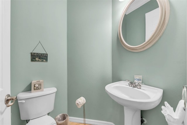 426 Magnolia Ave, Anna Maria, FL 34216 - bathroom with baseboards and toilet