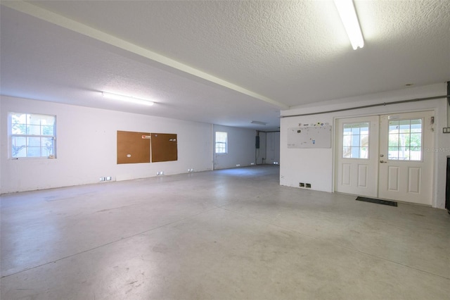 426 Magnolia Ave, Anna Maria, FL 34216 - entryway featuring visible vents, a textured ceiling, and finished concrete floors