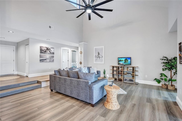75 Inlets Blvd Unit 75, Nokomis, FL 34275 - living room with baseboards, visible vents, wood finished floors, a high ceiling, and ceiling fan