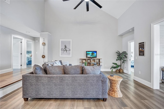 75 Inlets Blvd Unit 75, Nokomis, FL 34275 - living area featuring baseboards, wood finished floors, a ceiling fan, and high vaulted ceiling