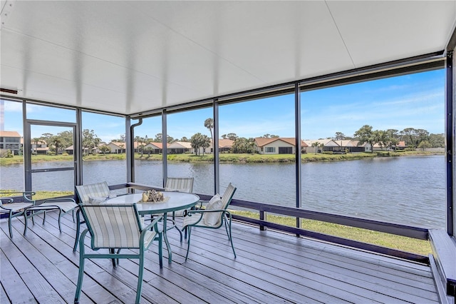 75 Inlets Blvd Unit 75, Nokomis, FL 34275 - sunroom / solarium with floor to ceiling windows, a deck with water view, wood finished floors, and plenty of natural light