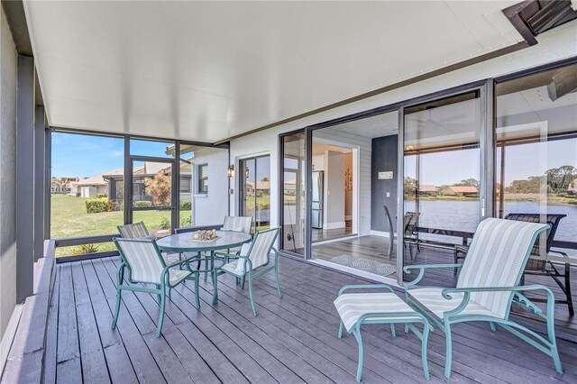 75 Inlets Blvd Unit 75, Nokomis, FL 34275 - sunroom with hardwood / wood-style floors, a water view, and floor to ceiling windows