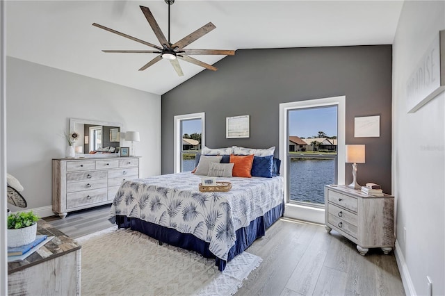 75 Inlets Blvd Unit 75, Nokomis, FL 34275 - bedroom with wood finished floors, lofted ceiling, baseboards, and ceiling fan