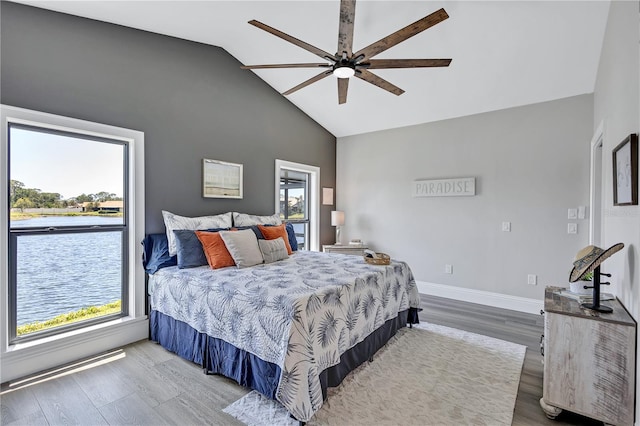 75 Inlets Blvd Unit 75, Nokomis, FL 34275 - bedroom with high vaulted ceiling, ceiling fan, baseboards, and wood finished floors