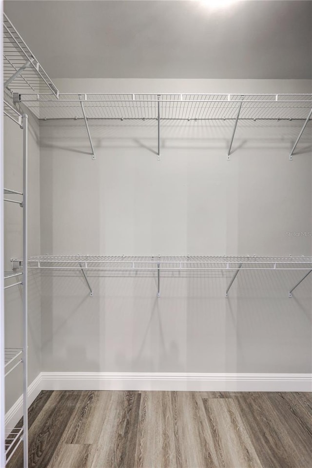 75 Inlets Blvd Unit 75, Nokomis, FL 34275 - walk in closet featuring wood finished floors