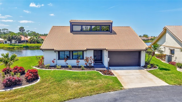75 Inlets Blvd Unit 75, Nokomis, FL 34275 - view of front of house featuring cooling unit, a water view, a tiled roof, and a front yard