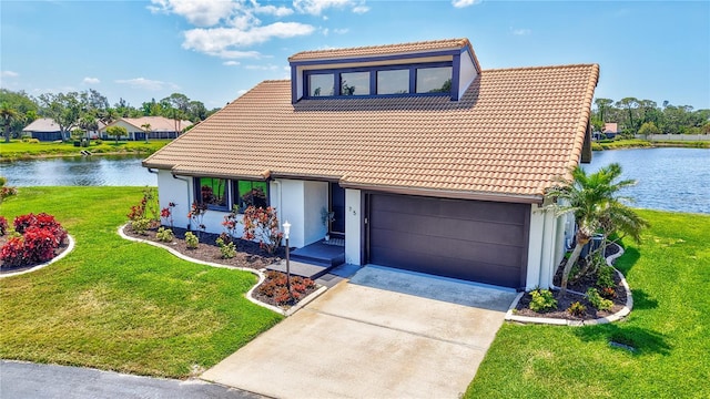 75 Inlets Blvd Unit 75, Nokomis, FL 34275 - view of front of house featuring stucco siding, a tile roof, driveway, and a water view