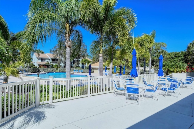 75 Inlets Blvd Unit 75, Nokomis, FL 34275 - view of patio / terrace featuring fence and a community pool