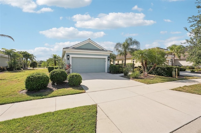view of front of home with a front yard, stucco siding, driveway, and an attached garage