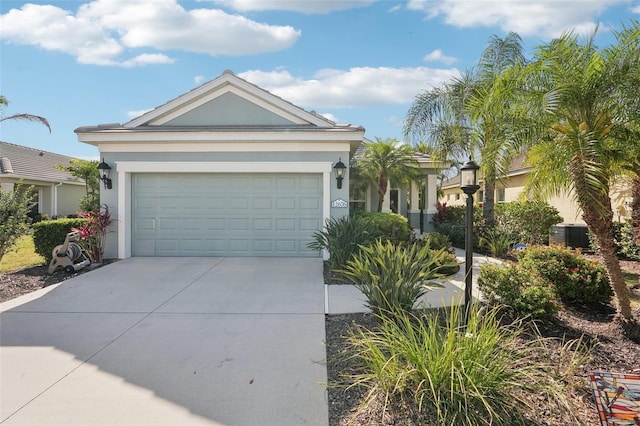 view of front facade featuring stucco siding, driveway, and a garage